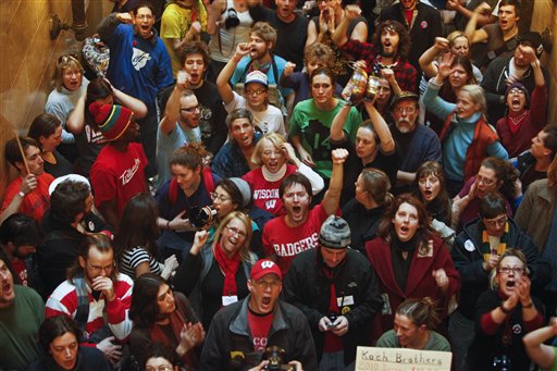 Opponents to the governor's bill to eliminate collective bargaining rights for many state workers protest at the state Capitol in Madison, Wis., Tuesday, March 1, 2011. Protesters have occupied the state Capitol for 14 days opposing the governor's proposed budget. 