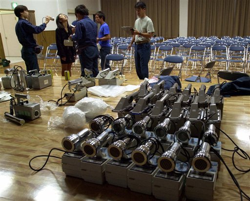 FILE - In this Oct. 1, 1999 file photo, radiation detection devices are prepared after a radiation leak at a uranium processing facility in Tokaimura, 110 kilometers (70 miles) northeast of Tokyo. Japan's half-century-long history of relying on nuclear power is riddled with scandals - one of the key reasons its people are deeply skeptical they are getting the full picture of the magnitude of the crisis at the Fukushima Dai-Ichi plant, where workers were racing against time to prevent a full melt