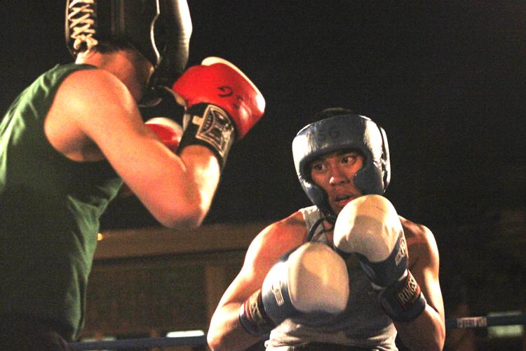 Kevin “The Killa” Abanilla, biology freshman, prepares to throw a punch during his April 1 fight at the Freret Street Gym. Abanilla won in a unanimous decision.