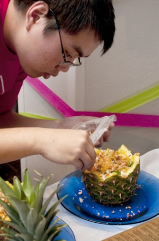 Johnathan Lam, biology freshman, puts some finishing touches on a pineapple dish. Loyola Asian Student Organization hosted the 2011 Iron Chef competition in the St. Charles Room on April 12.