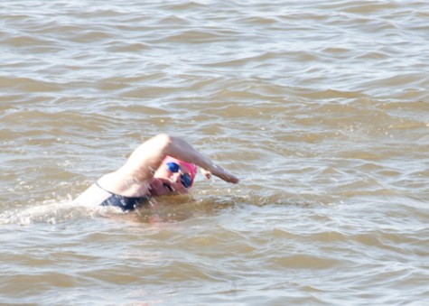 Donna Adams, Carrollton Hall area director, trains for the Oschner half Iron Man triathlon. Adams will have to compete a 56 mile bike, 13.1 mile run and 1.2 mile swim during the race.