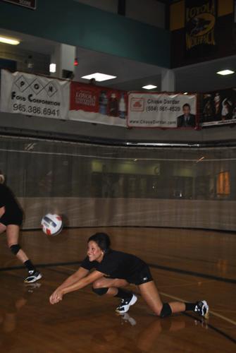 Business freshman Tiffany Walker dives for the ball at practice on Tuesday, Aug. 30 in The Den. Walker is one of many new additions to the Wolfpack volleyball team making a difference this season.