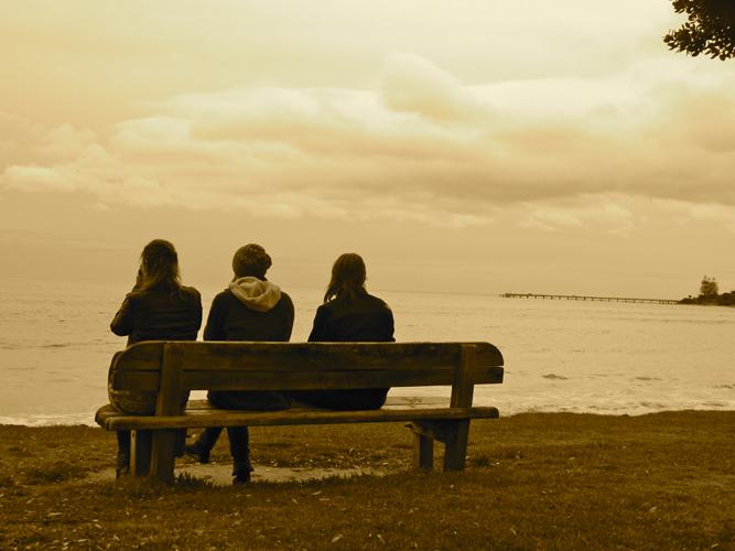 Mass communication junior Katie Gruzd sits with two friends at the Great Ocean Road in Australia. The Great Ocean Road is near Melbourne.