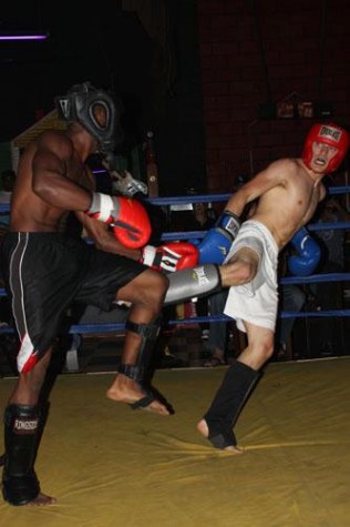 English writing sophomore Michael Sanchez face off against opponent Troy McGee at Marlene's Place Friday Sept.30. Sanchez has gone undefeated since kickboxing in March