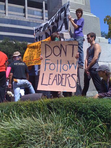 Josh Warren, political science sophomore, holds a sign at the Occupy New Orleans protest. 