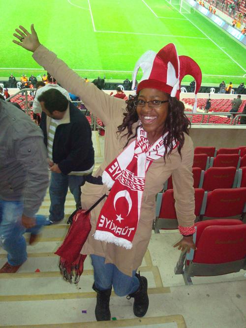 Joi Hollies gets excited for her new local team at football match between Turkey and Azerbjan for the EuroCup qualifier. Turkey won the game.