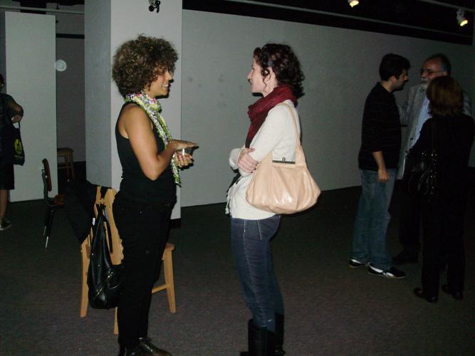 Artist Avish Khebrehzadeh, left, talks with a student after her lecture on her animated drawings on opening night, Nov. 8. The exhibit will run until Jan. 29, 2012.