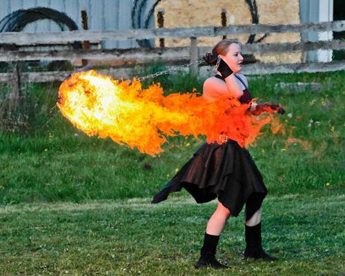 Danielle Latimer performs with a fire poi. Latimer first learned about fire performance in her hometown of Seattle.