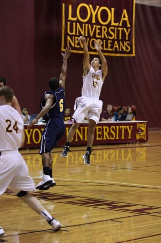 Marketing freshman Tyler James attempts a jump shot at the team’s season opener against Carver Bible College on Thursday, Nov. 3 in The Den. The Wolfpack defeated Carver 85-78.