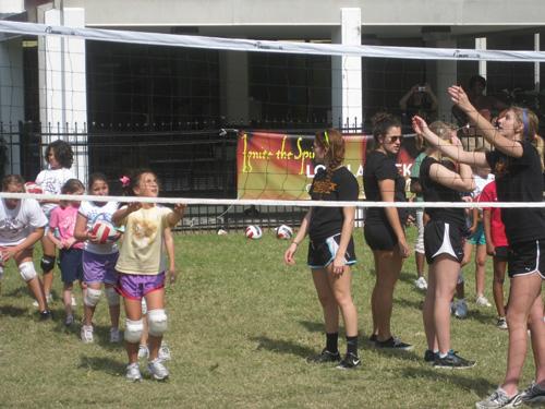 Members of the womens volleyball team spend the day with local Girl Scouts in the Residential Quad on Sunday. Oct 23.