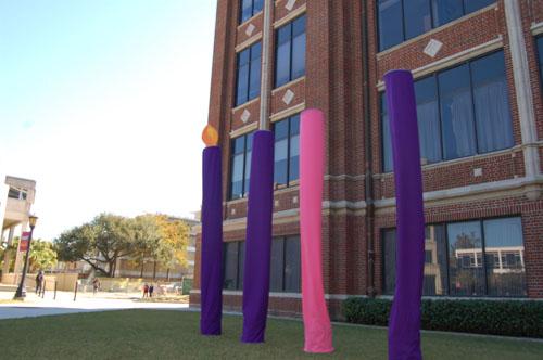 Four Advent candles stand outside of Bobet Hall. Each week a new “flame” is kindled atop the candles, indicating the time until Christmas. The fourth and final candle will be illuminated on Dec. 18. In order, the candles represent Hope, Love, Joy, and Peace, with Hope lit above.