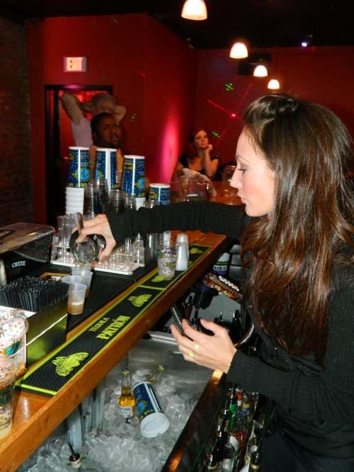 A bartender pours a drink at Krazy Korner. Krazy Korner offers interesting music and drink specials. 