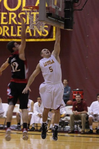 Corey Gray, biology senior and guard for the Loyola men’s basketball team, scores a point against William Carry University. Gray is on his way to breaking into the top 10 of all-time scorers for Loyola basketball.