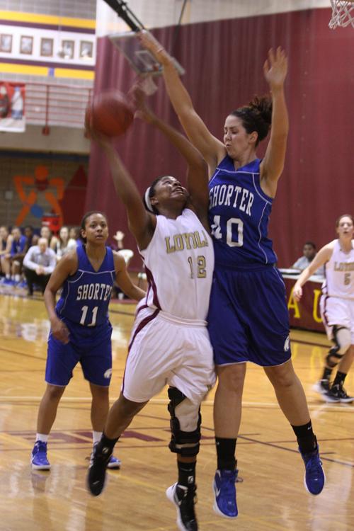 Jasmine Brewer, psychology sophomore and guard, goes up for a lay up, in the Dec. 2 game against Shorter University.  Though they lost, the women moved on to dominate their division with a 20-3 record.