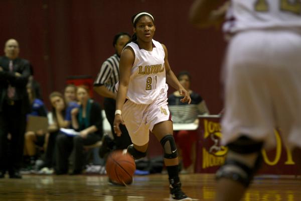 Mass communication freshman and women’s basketball gaurd Jeneicia Neely dribbles down the court during the Feb. 11 women’s basketball game against Faulker University. The Lady Wolfpack won 70-63.  The Ladypack is now in Rome, Ga. for the Southern States Athletic Conference tournament.