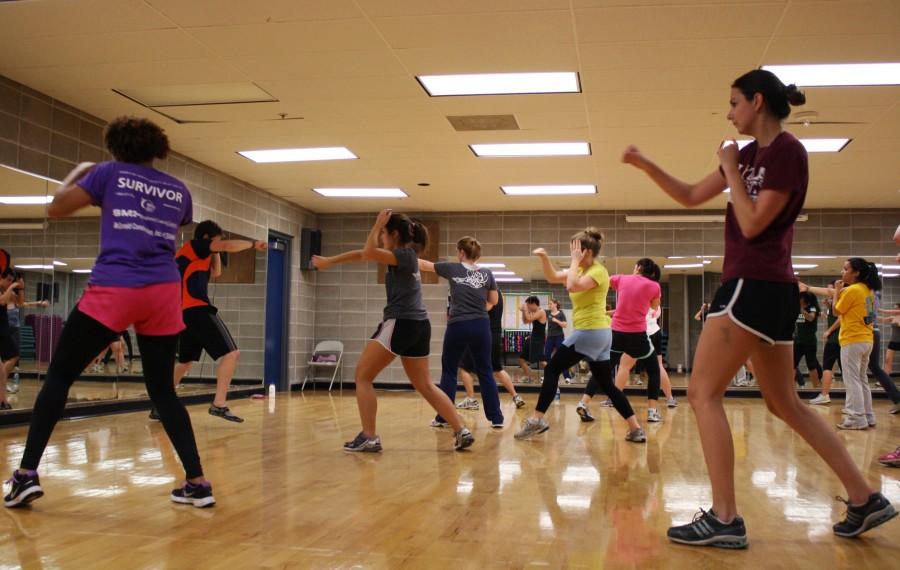 Students get a workout during a kickboxing class, taught by instructor Patrick Lindsley, in the Recreational Sports Complex Thursday, Feb. 9.