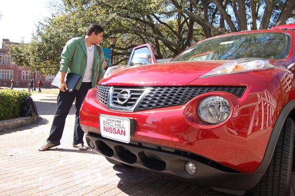 Theater and mass communication freshman James Phelps looks at a Nissan Juke during a Nissan promotion organized by the Ad Team in the Peace Quad March 7.  The Ad Team hosted the event to gain customer feedback for its campaign. 