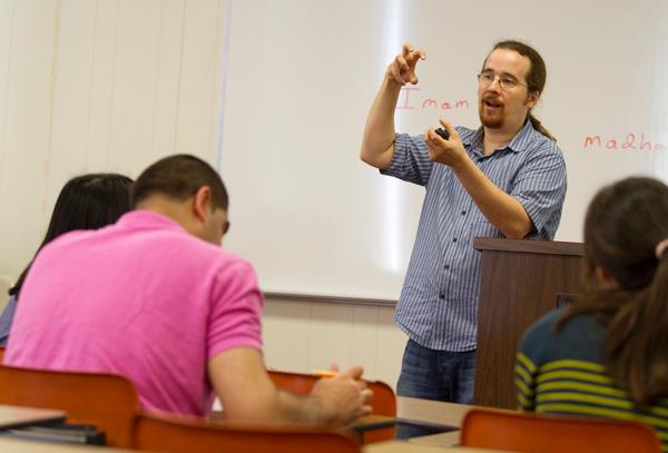 Aaron Spevack, professor of religious studies, lectures in his Discovering Islam class in Marquette Hall Tuesday, March 13. Spevack recently wrote a new book.