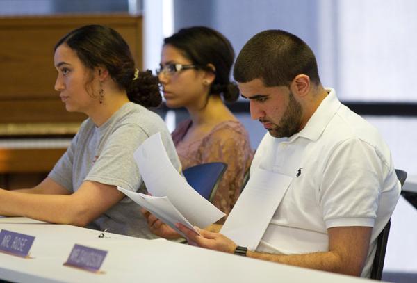 New SGA president Khaled Badr, right, looks over a proposal brought before the student government at the weekly SGA meeting Wednesday, April 25.