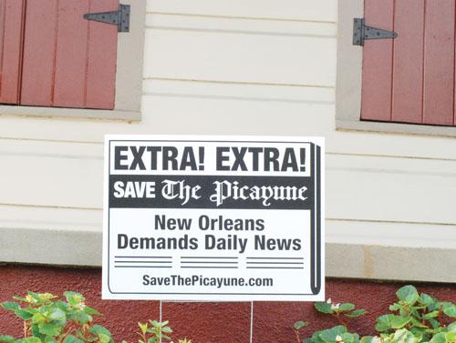 A Save The Picayune poster sits out front on an uptown lawn. Since The Times-Picayune cut down to three days a week, many citizens have joined this movement to try and restore the paper to full place.
