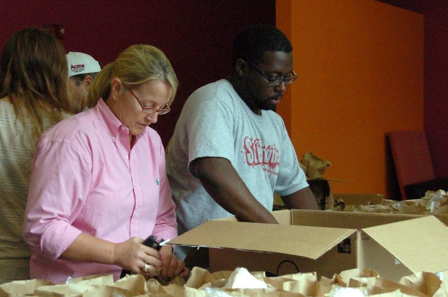 Vice president for student affairs and associate provost of academic affairs Cissy Petty prepares bagged lunches with assistant director of campus activities Courtney Williams on Aug. 28 before hurricane Isaac hit campus. The bagged dinners are for students housed in the dorms during the hurricane.