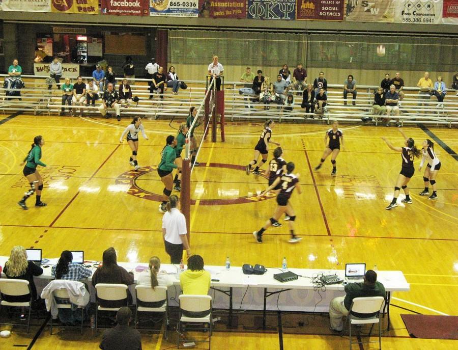 The Loyola Wolf Pack receives a serve from University of Arkansas Monticello during the Loyola-hosted Hampton Inn Invitational. The Pack defeated Arkansas Monticello in straight sets and went undefeated in the tournament. 