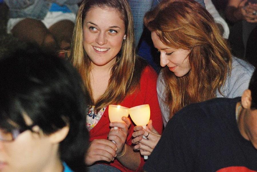 Music senior Rachael White and acounting sophomore Aleksandra Golanka hold their candles together at the “Take Back the Night” march. Loyola, Tulane and Dillard students marched at the 21st annual march against sexual violence on women and men.