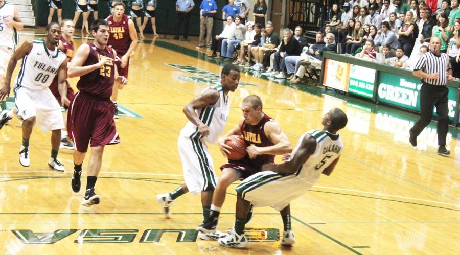 Former point guard Corey Grey A’12 drives to the basket during last year’s Battle of Freret game against Tulane University. Tulane beat the Wolf Pack 70-68 at the Fogelman Arena on Nov. 6, 2011.