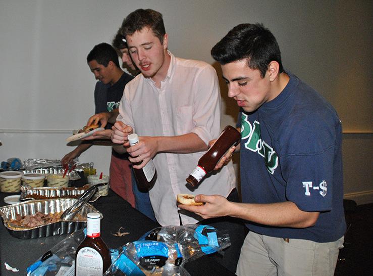 Phi Kappa Psi member Jordan Nabizadeh mingles with prospective members at their first round recruitment party on Jan. 25. Fraternities will admit new pledges next week. 