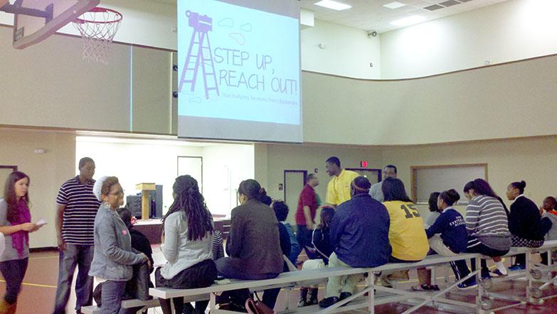 Loyola Bateman Team members set up to for their anti-bullying presentation at Franklin Avenue Baptist Church. Their campaign, titled “Step Up, Reach Out,” is an effort to teach New Orleans about the consequences of bullying. 