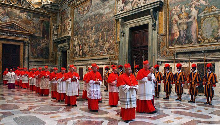 In this photo, taken on April 18, 2005 and released by the Vatican paper L’Osservatore Romano, cardinals walk in procession to the Sistine Chapel at the Vatican at the beginning of the conclave. This month’s conclave to elect the 266th leader of the world’s 1.2 billion Catholics will have all the trappings of papal elections past, with the added twist that this time around, the current pope is still very much alive. 