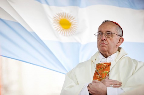 In this Aug. 7, 2009 file photo, Argentina’s Cardinal Jorge Bergoglio gives a Mass outside the San Cayetano church where an Argentine flag hangs behind him in Buenos Aires, Argentina. On Wednesday, March 13, 2013, Bergoglio was elected pope, the first ever from the Americas and the first from outside Europe in more than a millennium. He chose the name Pope Francis I.