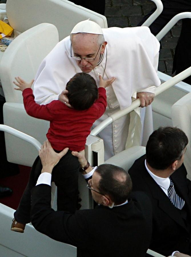 Pope+Francis+kisses+a+child+in+St.+Peter%E2%80%99s+Square+at+the+Vatican%2C+Tuesday%2C+March+19%2C+2013.+Pope+Francis+officially+began+his+ministry+as+the+266th+pope+on+Tuesday+in+an+installation+Mass+simplified+to+suit+his+style%2C+but+still+grand+enough+to+draw+princes%2C+presidents%2C+rabbis%2C+muftis+and+thousands+of+ordinary+people+to+St.+Peter%E2%80%99s+Square+to+witness+the+inauguration+of+the+first+pope+from+the+New+World.