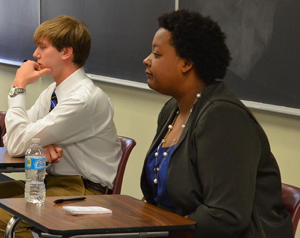Jasmine Barnes, president-elect, and Blake Corley, vice president-elect, listen at an SGA candidates forum. 