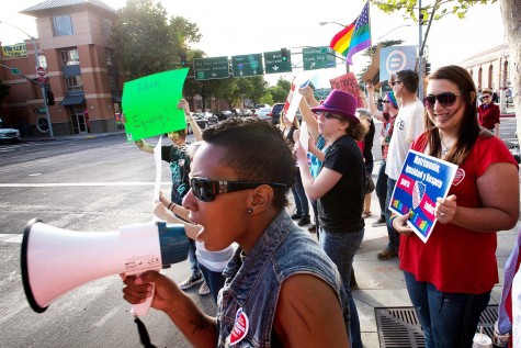 Rae Tate, of Sacramento, Calif. leads the supporters of gay marriage during a demonstration at the Federal Courthouse in Sacramento, Calif., on Tuesday, March 26. The U.S. Supreme Court, in the second of back-to-back gay marriage cases, turns to a constitutional challenge to the federal law that prevents legally married gay Americans from collecting federal benefits generally available to straight married couples.