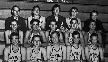 Players and coaches of the 1945 Loyola men’s basketball team pose for a photograph on the bleachers of the old basketball court. The team went on to bring home a national basketball championship amidst the surrounding events of World War II. 