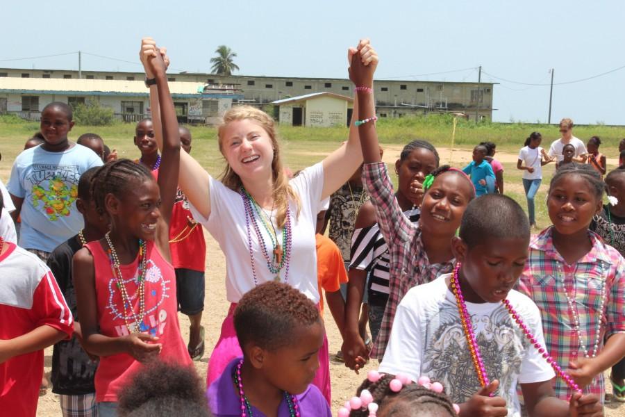 Annie+McClure%2C+biology+pre-med+and+Latin+American+studies+junior%2C+tells+campers+about+Mardi+Gras+celebrations+in+New+Orleans.++Volunteers+did+various+activities+with+children+including+playing+soccer+and+teaching+math+in+a+classroom.+