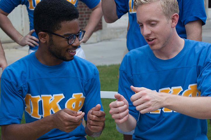 Akeem Biggs, theatre sophomore, talks with Alex Kneib, history pre-law junior. The fraternity entered this semester with hopes to expand.