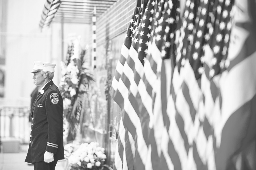 A firefighter stands near the entrance of the 9/11 Memorial in New York. Memorials were held across the U.S. for those killed in the 9/11 terrorist attacks