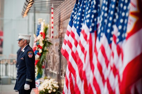 A firefighter stands near the entrance of the 9/11 Memorial in New York. Memorials were held across the U.S. for those killed in the 9/11 terrorist attacks