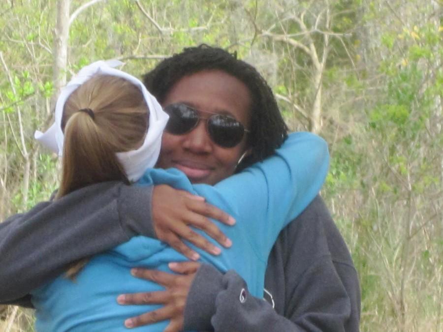 Carlyn Worthy, A12, receives a hug from Michelle Saint, A13, after Worthy gave the faith talk during the 2012 Fall Awakening Retreat.  Loyola students have attended Awakening for more than a decade.