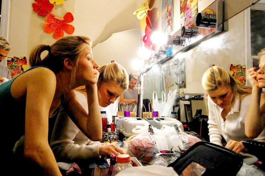 Theatre arts sophomore Kali Russell and theatre arts senior Charlotte Voelkel apply makeup backstage at a dress rehearsal. "Evil Dead