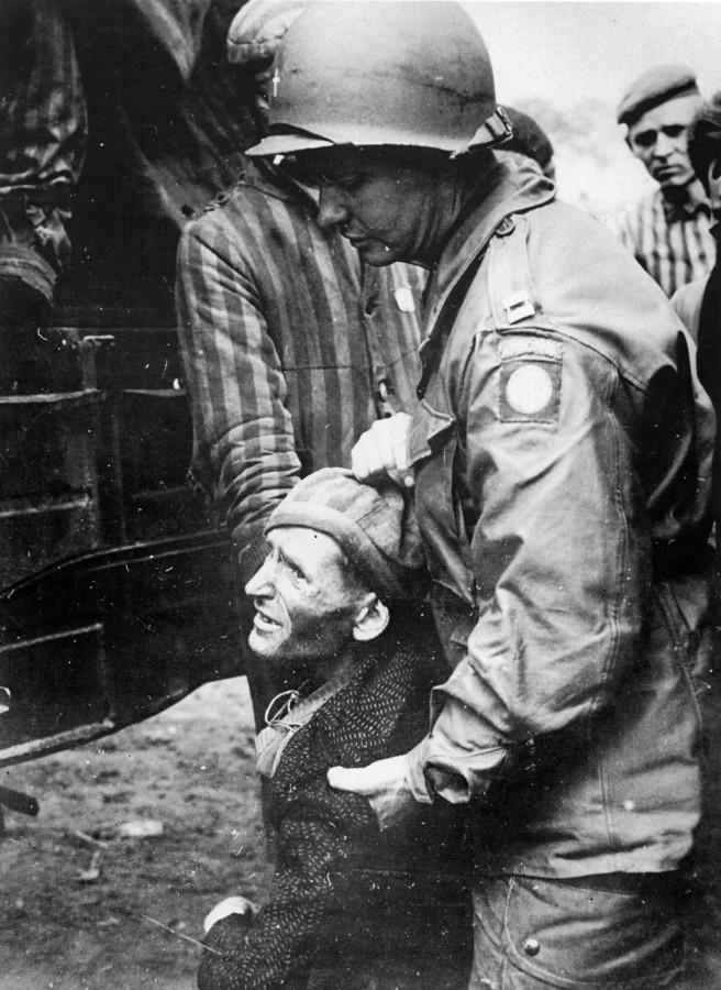 Archbishop Philip M. Hannan carries a concentration camp survivor while he serves as a chaplain in World War II.  Hannan was New Orleans Archbishop for 46 years.“The Archbishop Wore Combat Boots