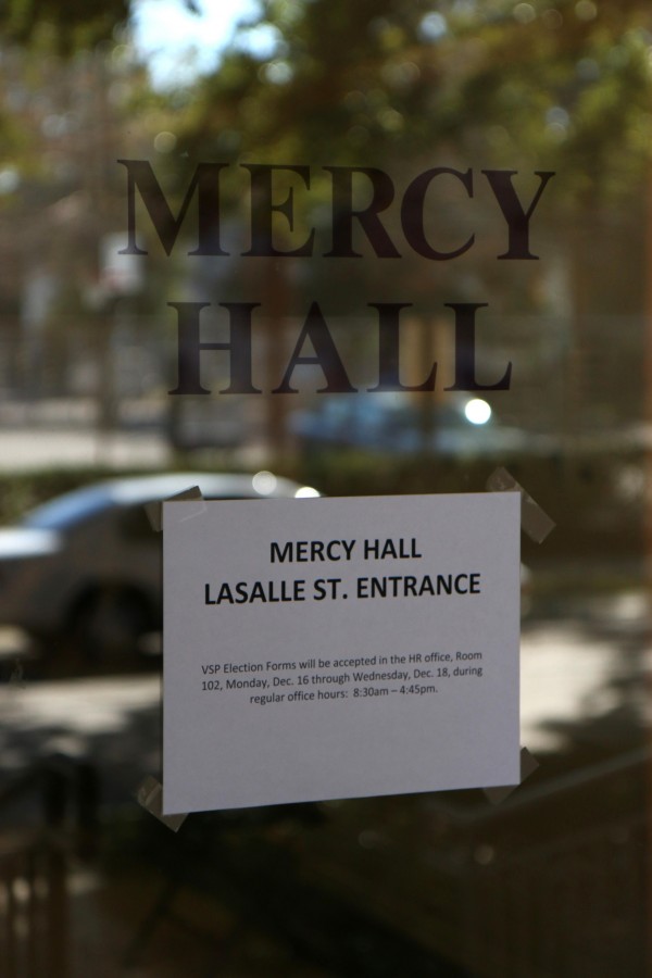 A sign on the entrance to Mercy Hall directs applicants to the office of human resources. The election period for the volunteer retirement program began on Monday, Dec. 16.