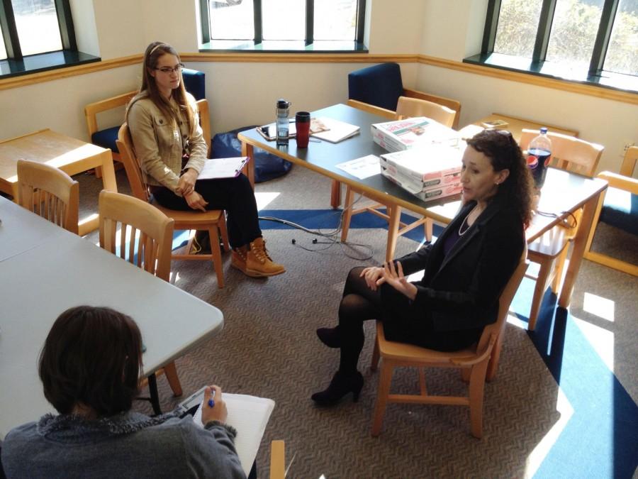 Naomi Yavneh, director of the University Honors Program, advises Mara Steven, history/pre-law junior, and Samantha Ybarzabal, psychology junior, during a community engagement portfolio meeting. The new honors curriculum emphasizes Jesuit values such as service.