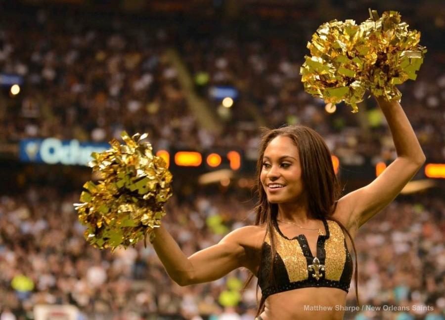 Marketing+junior+Lauren+Jones+cheers+on+the+New+Orleans+Saints+during+the+2013+season.+Jones+spent+roughly+six+hours+a+week+in+dance+practices+to+prepare+for+home+games.