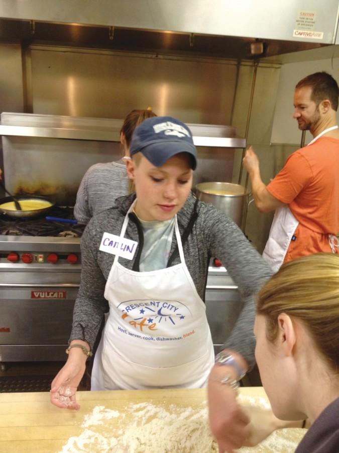 Caitlin Vanderwolf, English writing freshman and first-year group member, helps cook breakfast in the kitchen at Crescent City Cafe. Vanderwolf is one of several individuals in Loyola’s Christian Life Communities who sought to strengthen their relationships with each other and with the greater New Orleans community by volunteering at Crescent City Cafe on Jan. 18.