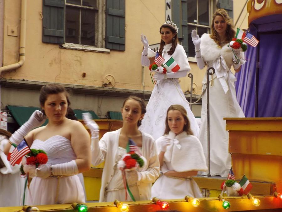 Psychology sophomore Caroline Knecht, far right, rides on the queen’s float in the Italian American Marching Club’s St. Joseph’s Day Parade on Saturday, March 15, 2014. The parade takes place once a year around March 19, the feast day of St. Joseph.