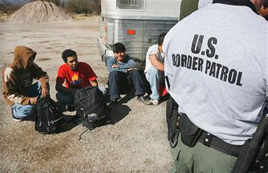 A United States border patrol agent processes immigrants at the Arizona-Mexico border. Arizona’s immigration policy is one of the strictest in the United States.