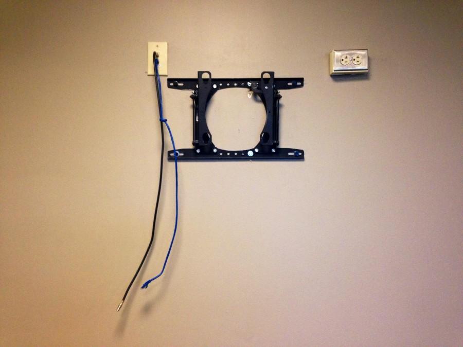 The mount and cables hang on a wall on the fourth floor of the Communications/Music Complex. LUPD is investigating the theft of the television screen. 